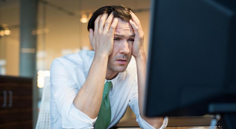 Touchés de plein fouet par les restructurations, les banquiers ont le blues. GETTY IMAGES/ALVAREZ 